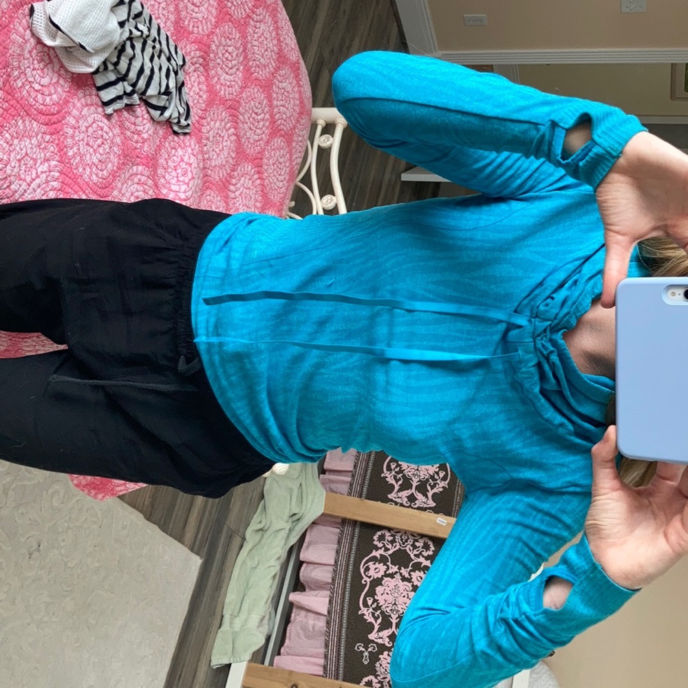 Fitting blue running jacket with high neck